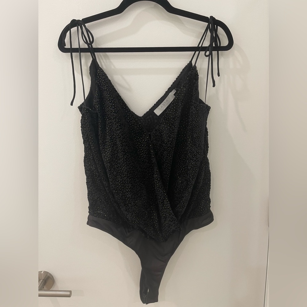 ASTR size L surplice bodysuit.